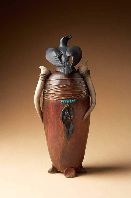Bronze vessel with a black crow on top by Star Liana York
