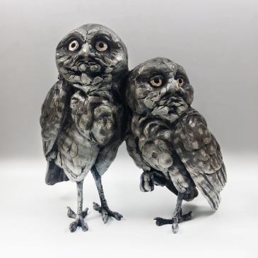 A bronze sculpture of two small owls by Bryce Pettit as seen at Sorrel Sky Gallery